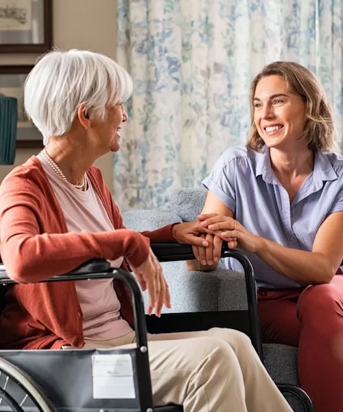 Happy adult woman visiting her elderly mother 600h